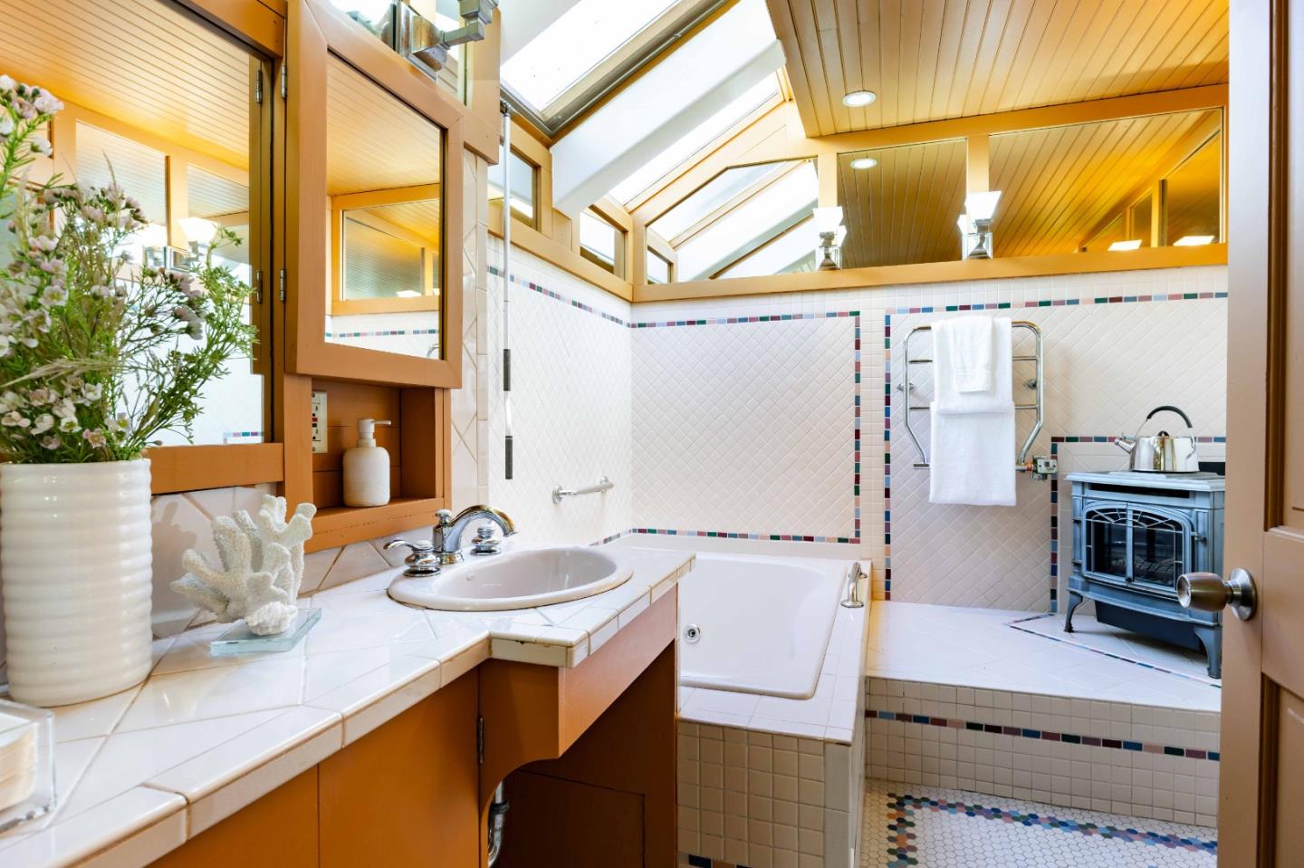 104 Clover Lane Menlo Park, CA 94025 - Photo 12 of 26 a bathroom with a sink and a mirror