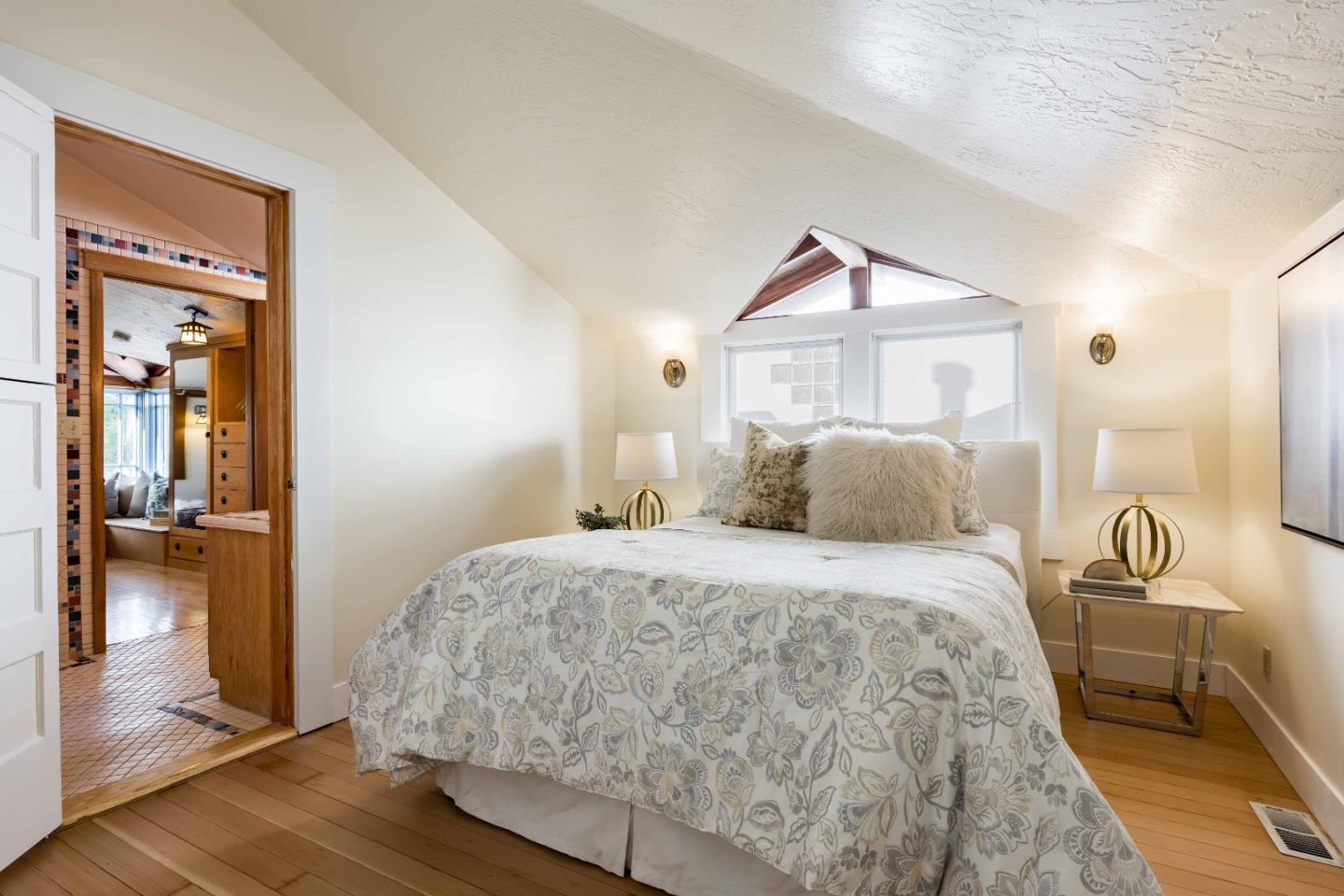 104 Clover Lane Menlo Park, CA 94025 - Photo 17 of 26 a bedroom with a bed and a mirror