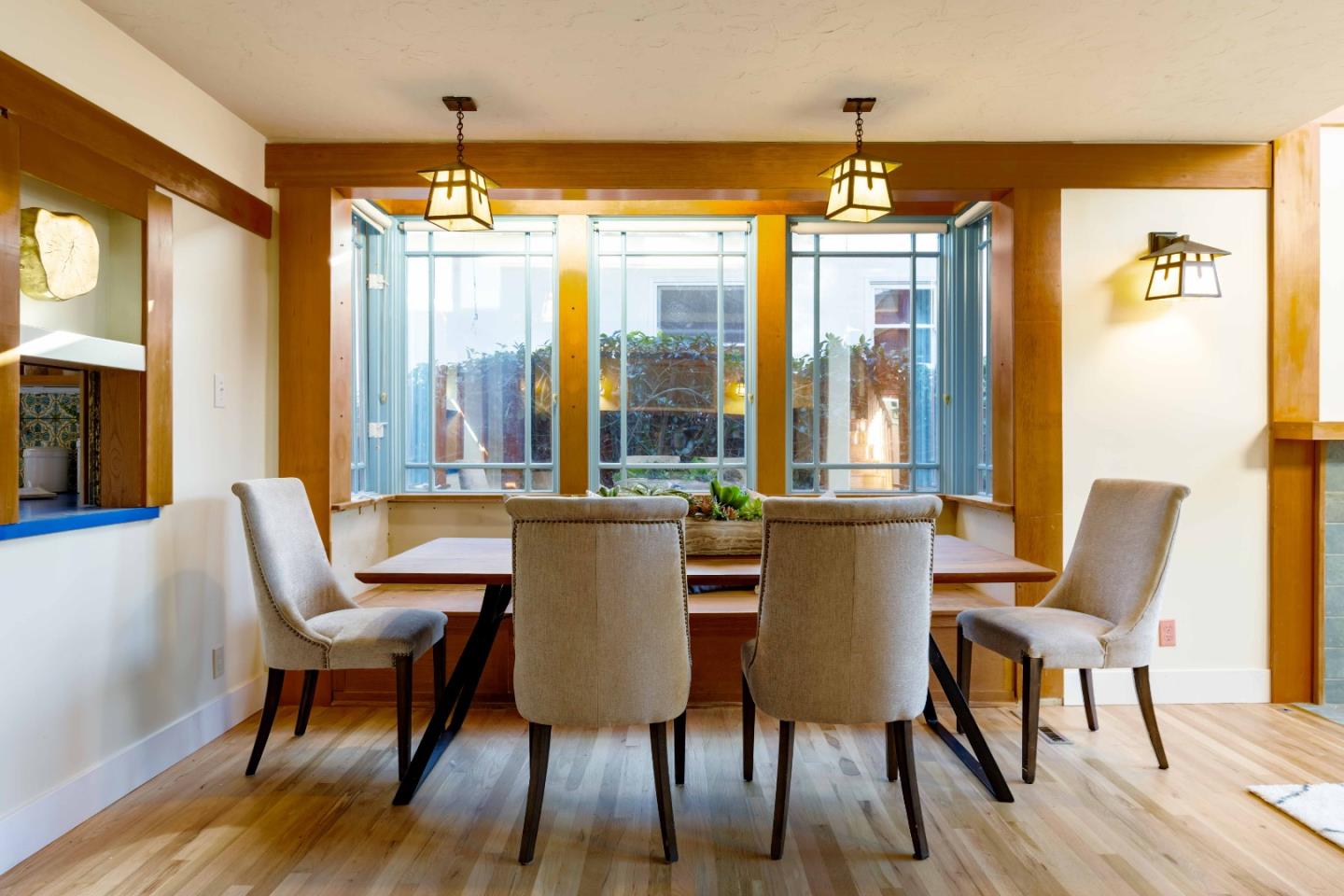 104 Clover Lane Menlo Park, CA 94025 - Photo 5 of 26 a dining room with furniture a chandelier and wooden floor