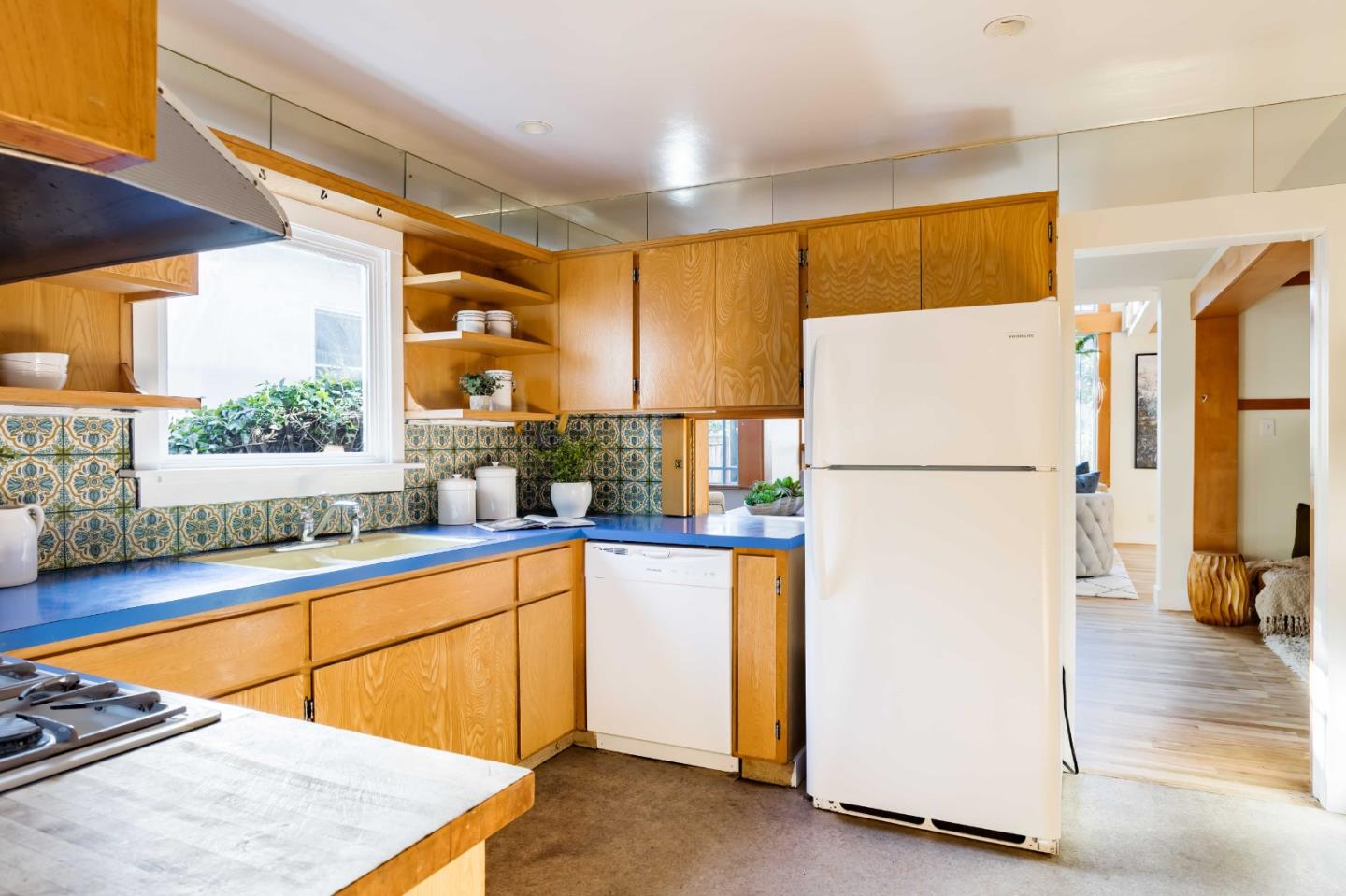 104 Clover Lane Menlo Park, CA 94025 - Photo 7 of 26 a kitchen with a refrigerator a stove and a sink