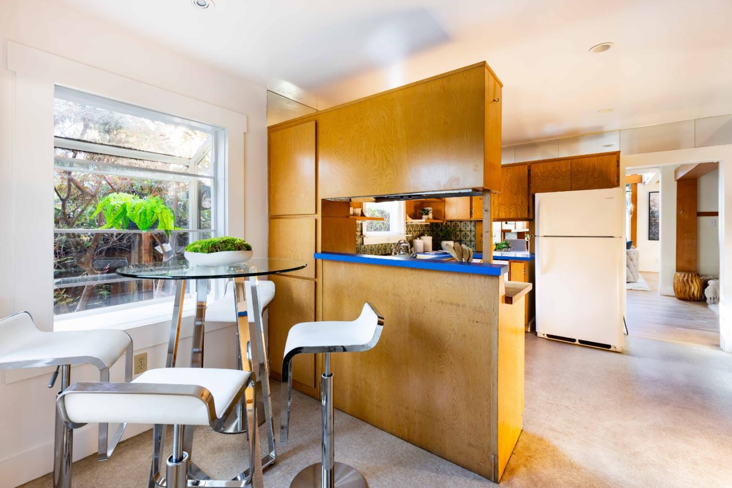 104 Clover Lane Menlo Park, CA 94025 - Photo 9 of 26 a dining room with furniture a chandelier and a wooden floor