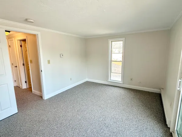 a view of empty room with windows