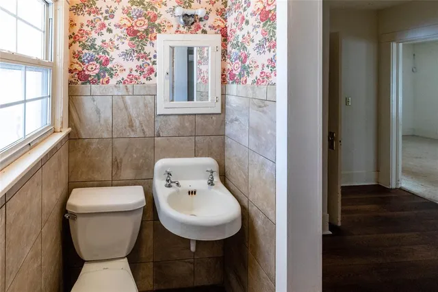 a bathroom with a toilet and a sink
