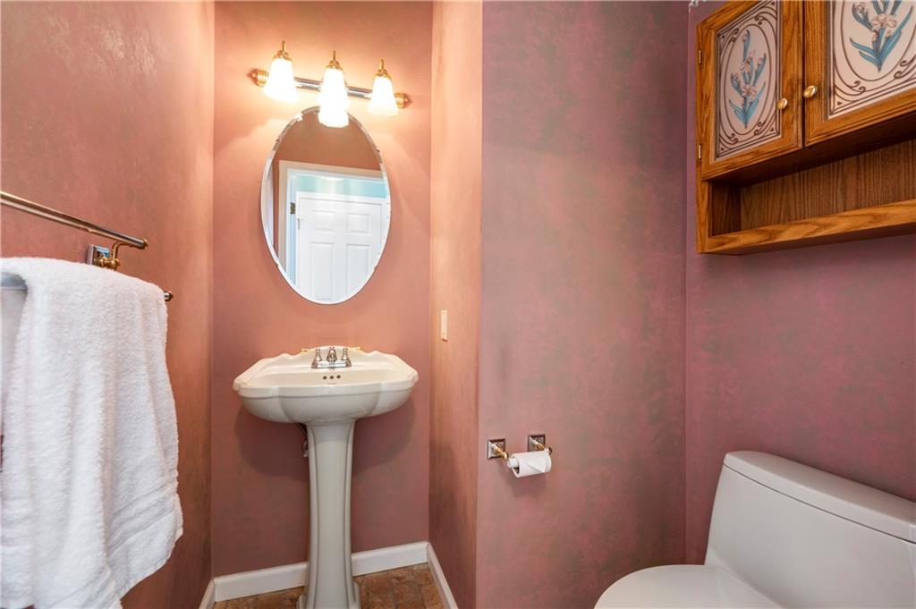 372 Indian Ridge Drive Coraopolis, PA 15108 - Photo 14 of 30 a bathroom with a sink a mirror and a toilet