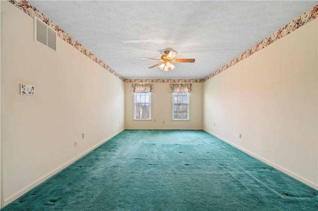 372 Indian Ridge Drive Coraopolis, PA 15108 - Photo 15 of 30 a view of a big room with windows and chandelier fan