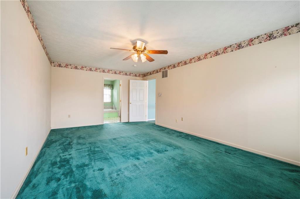 372 Indian Ridge Drive Coraopolis, PA 15108 - Photo 16 of 30 a view of an empty room with chandelier fan and window