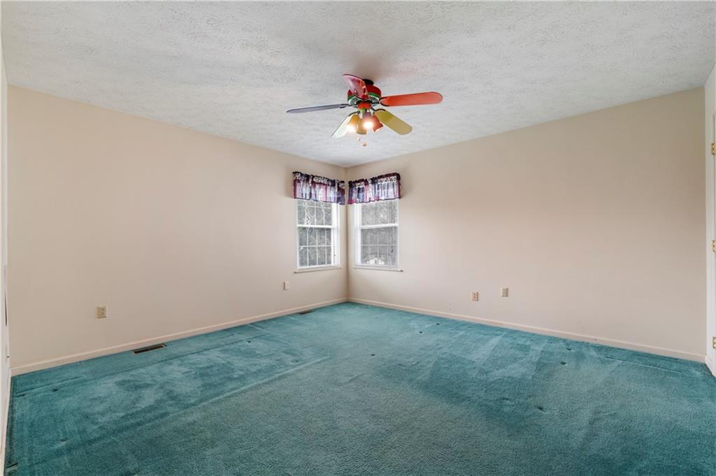 372 Indian Ridge Drive Coraopolis, PA 15108 - Photo 21 of 30 an empty room with windows and fan