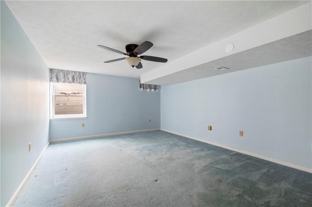 372 Indian Ridge Drive Coraopolis, PA 15108 - Photo 25 of 30 an empty room with a ceiling fan and window