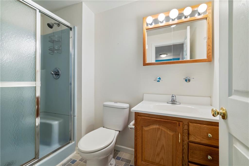 372 Indian Ridge Drive Coraopolis, PA 15108 - Photo 26 of 30 a bathroom with a sink a toilet and shower