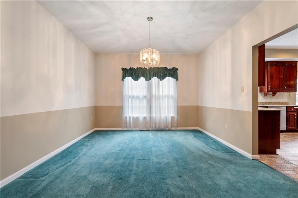 372 Indian Ridge Drive Coraopolis, PA 15108 - Photo 10 of 30 a view of a chandelier in an empty room with a window