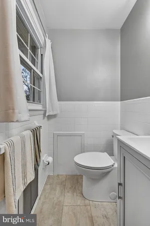 a bathroom with a toilet and a sink