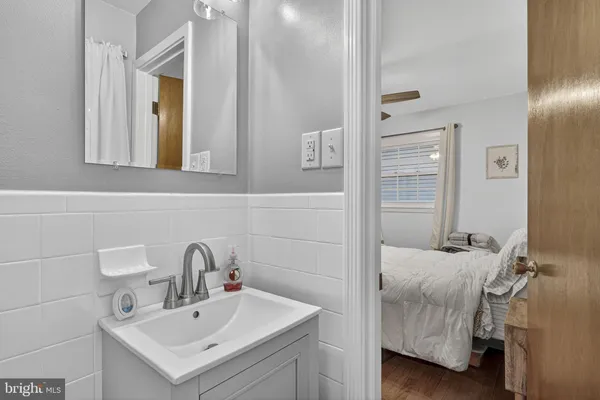 a bathroom with a sink and mirror