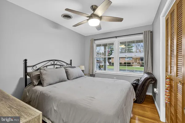 a bedroom with bed and a window