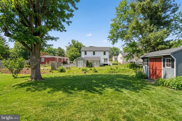 a front view of house with yard and trees
