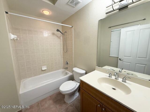 9745 Touchton Road, Unit 1103 Jacksonville, FL 32246 - Photo 15 of 29 a bathroom with a bathtub shower sink vanity mirror and toilet