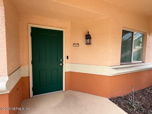 9745 Touchton Road, Unit 1103 Jacksonville, FL 32246 - Photo 2 of 29 a bedroom with a bed and a window