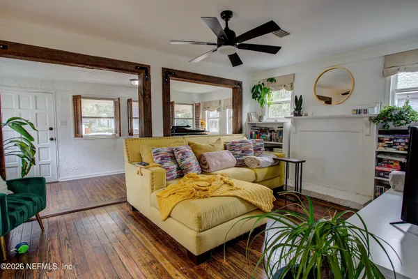 a living room with furniture and a large window