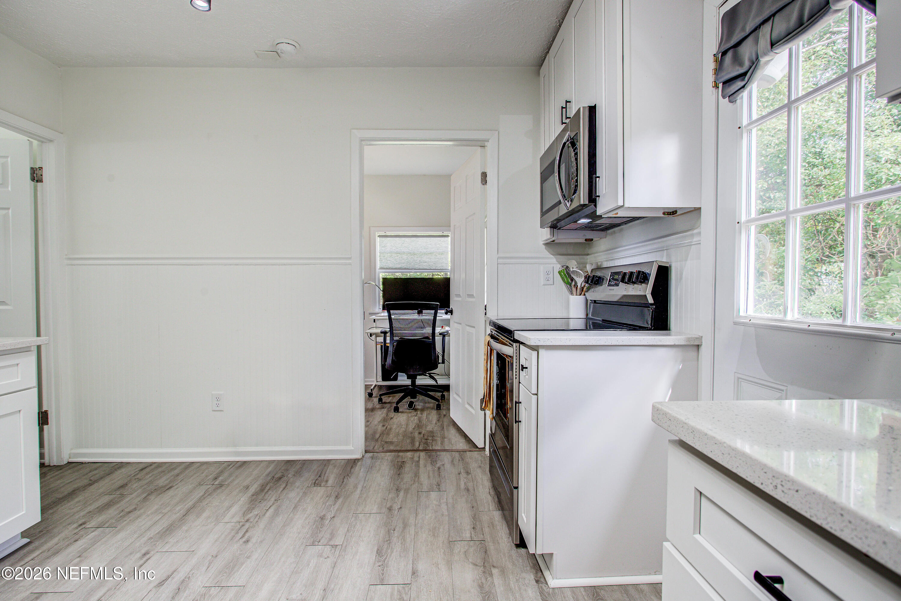 1441 Rensselaer Avenue Jacksonville, FL 32205 - Photo 17 of 33 a kitchen with stainless steel appliances a refrigerator a sink a stove and cabinets