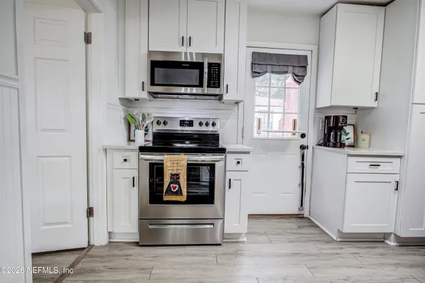 a kitchen with stainless steel appliances a refrigerator and a sink