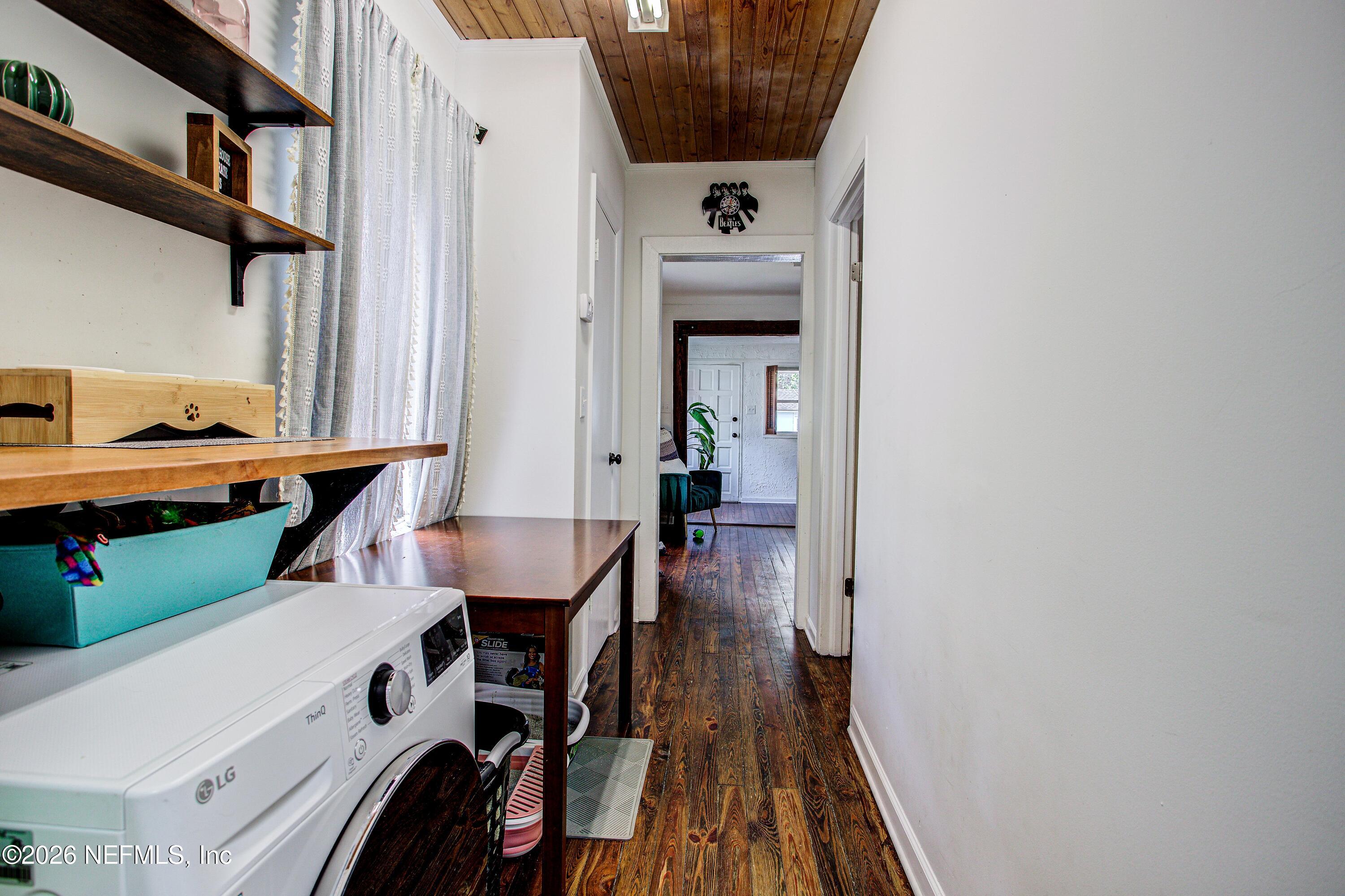 1441 Rensselaer Avenue Jacksonville, FL 32205 - Photo 25 of 33 a view of a hallway with furniture and wooden floor