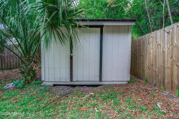 a view of a backyard with a small cabin