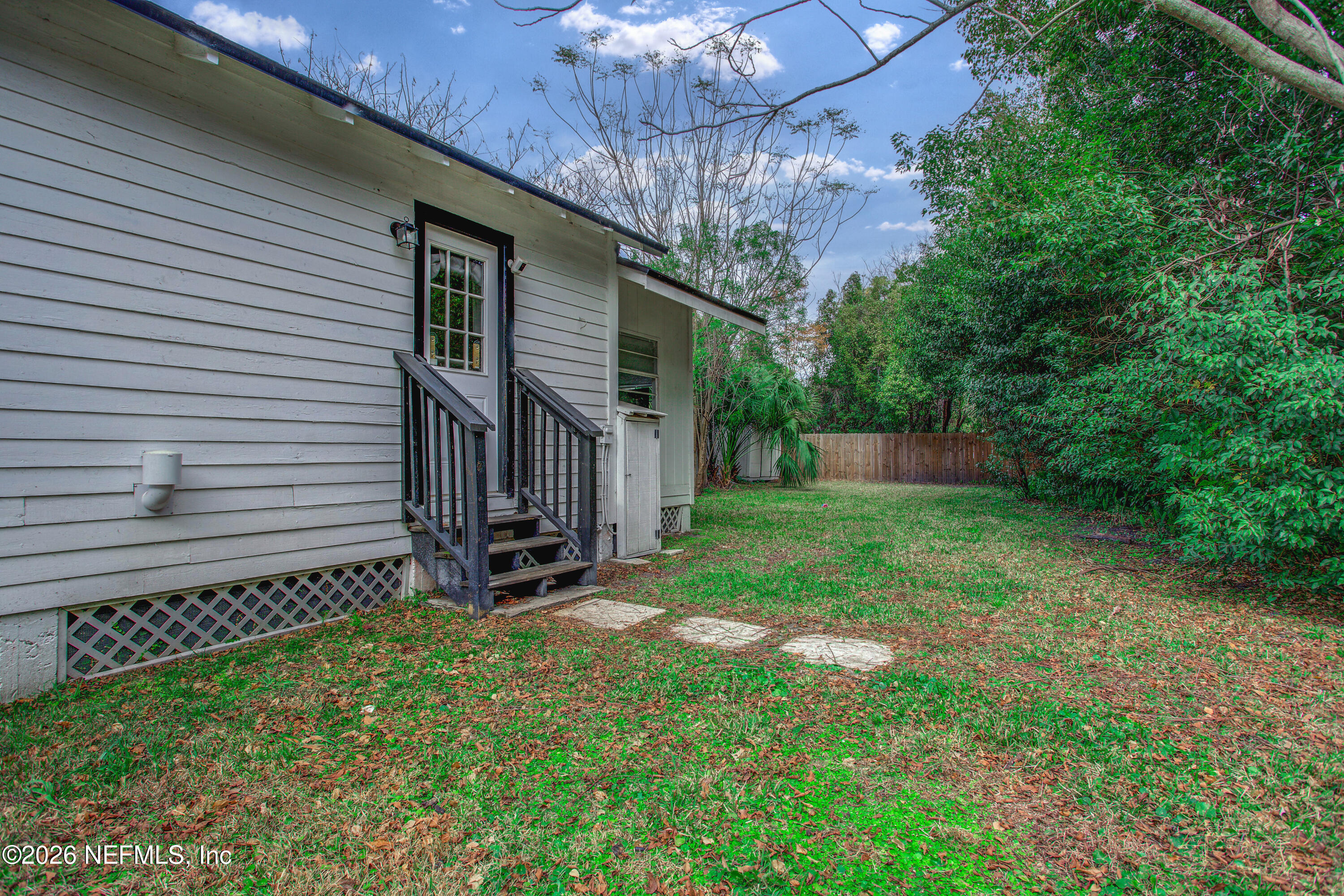 1441 Rensselaer Avenue Jacksonville, FL 32205 - Photo 32 of 33 a view of a backyard with a small cabin