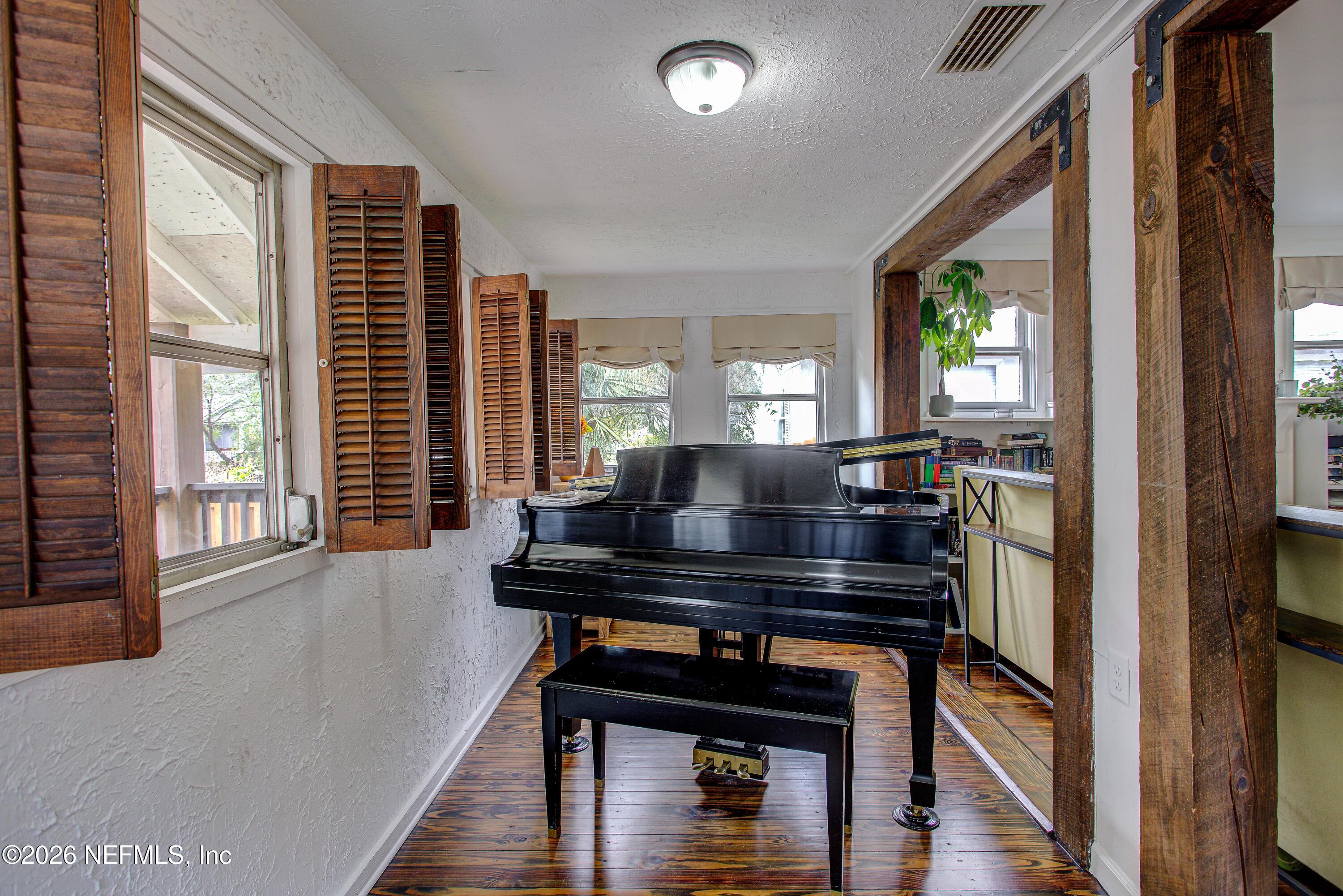 1441 Rensselaer Avenue Jacksonville, FL 32205 - Photo 9 of 33 a living room with furniture and a wooden floor