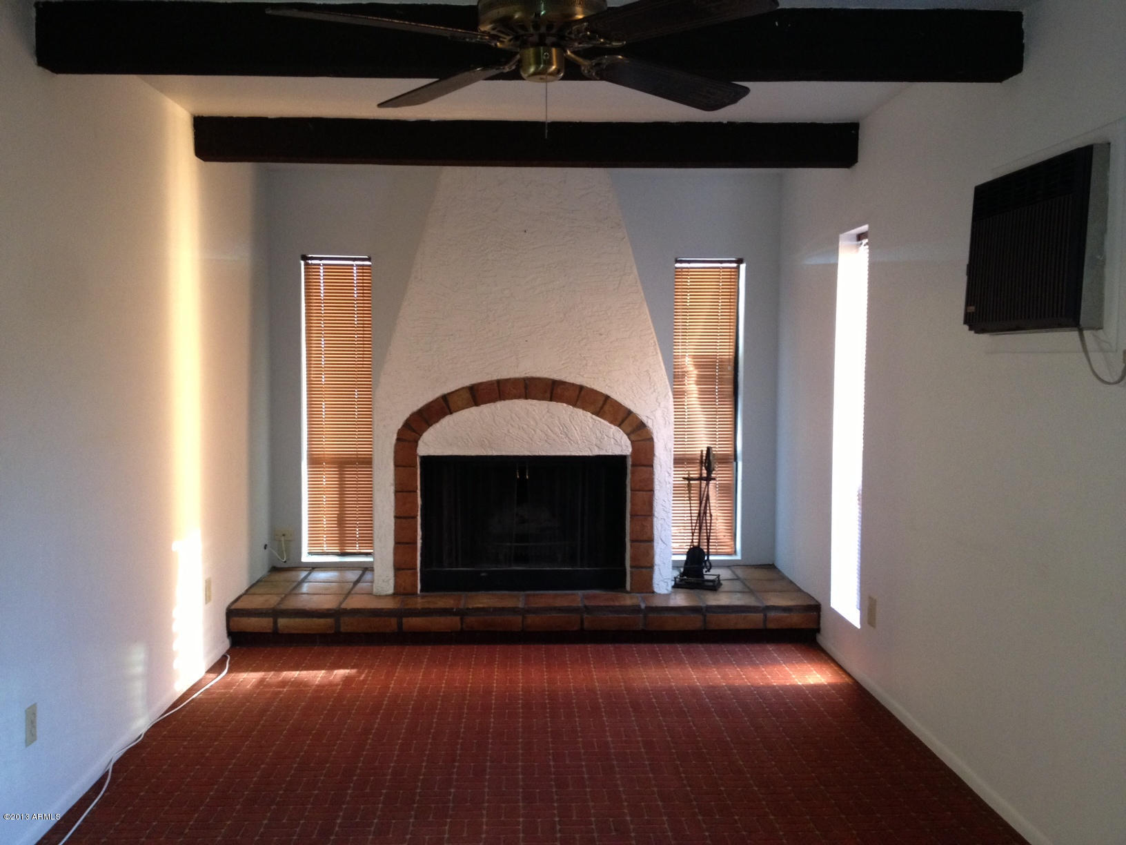 5502 West Hatcher Road Glendale, AZ 85302 - Photo 1 of 17 a living room with a fireplace