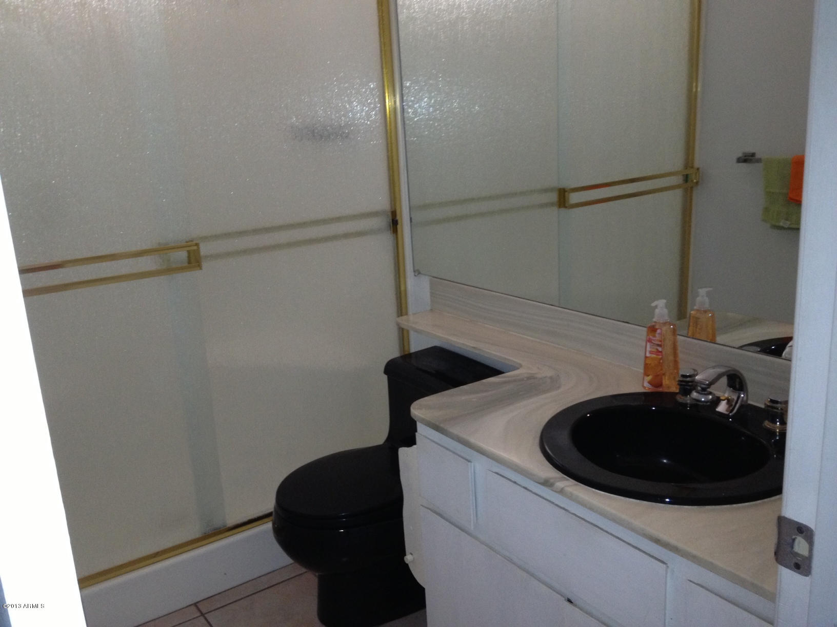 5502 West Hatcher Road Glendale, AZ 85302 - Photo 7 of 17 a bathroom with a sink and a mirror