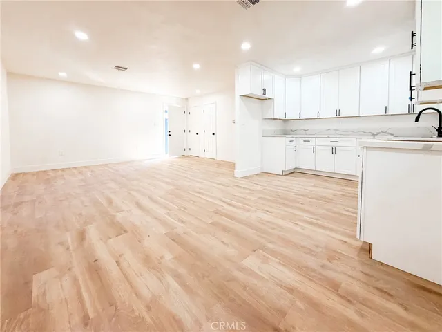 a view of kitchen with wooden floor