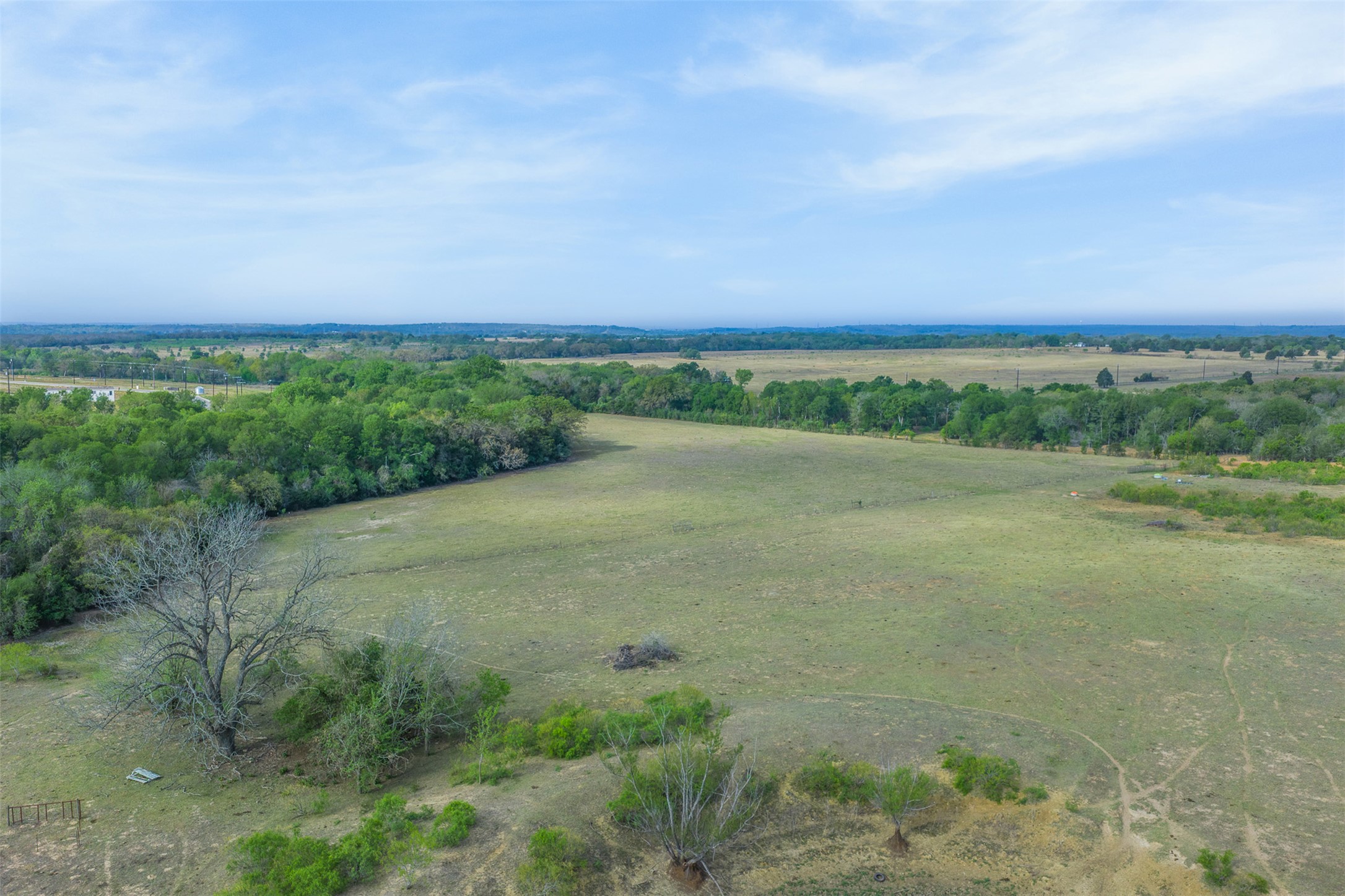 579 Lower Elgin Road Elgin, TX 78621 - Photo 2 of 40 a view of a field with an ocean in background