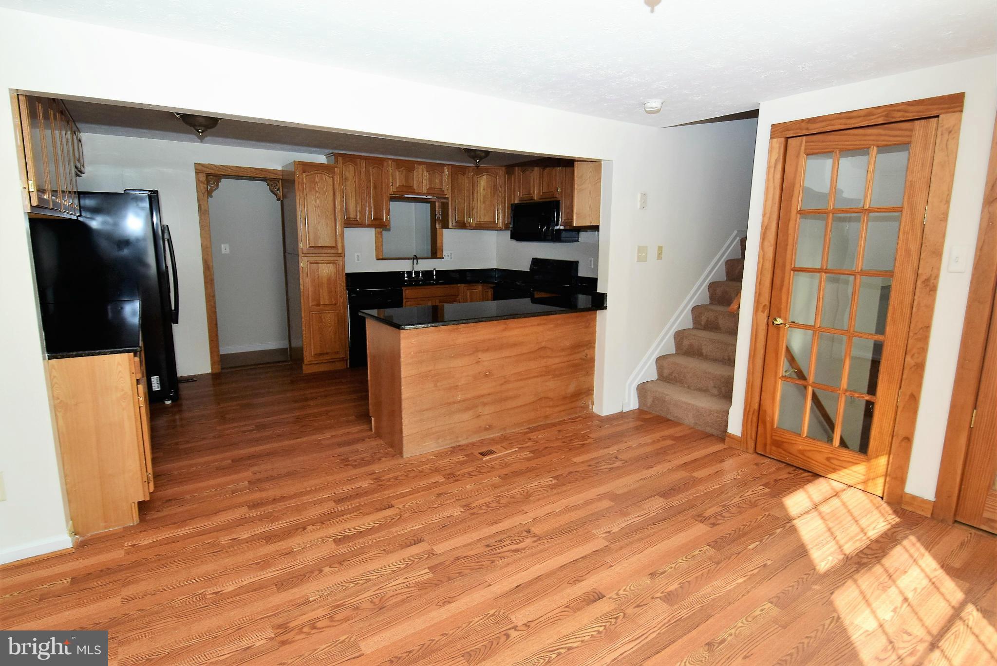 8148 Silo Road Severn, MD 21144 - Photo 5 of 30 Living Room looking into kitchen