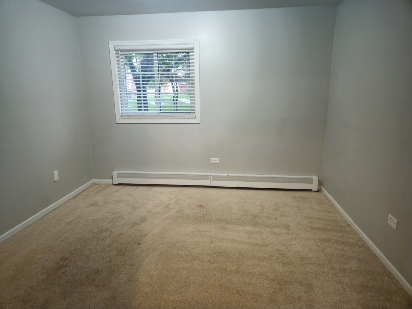 125 West Elk Trail, Unit 124 Carol Stream, IL 60188 - Photo 11 of 11 an empty room with a window