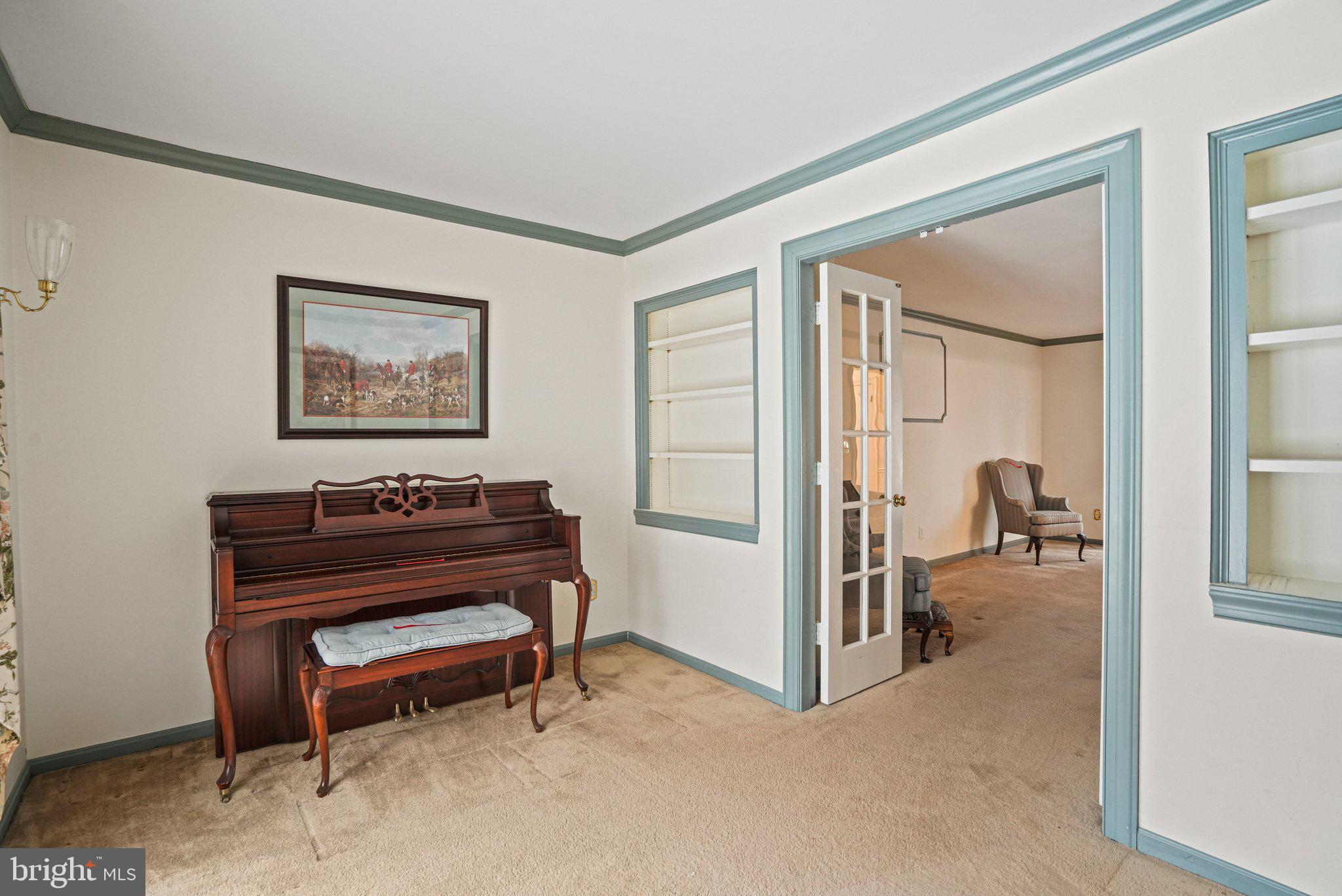 12737 Triple Crown Road Gaithersburg, MD 20878 - Photo 11 of 61 a view of a room with a piano and wooden floor
