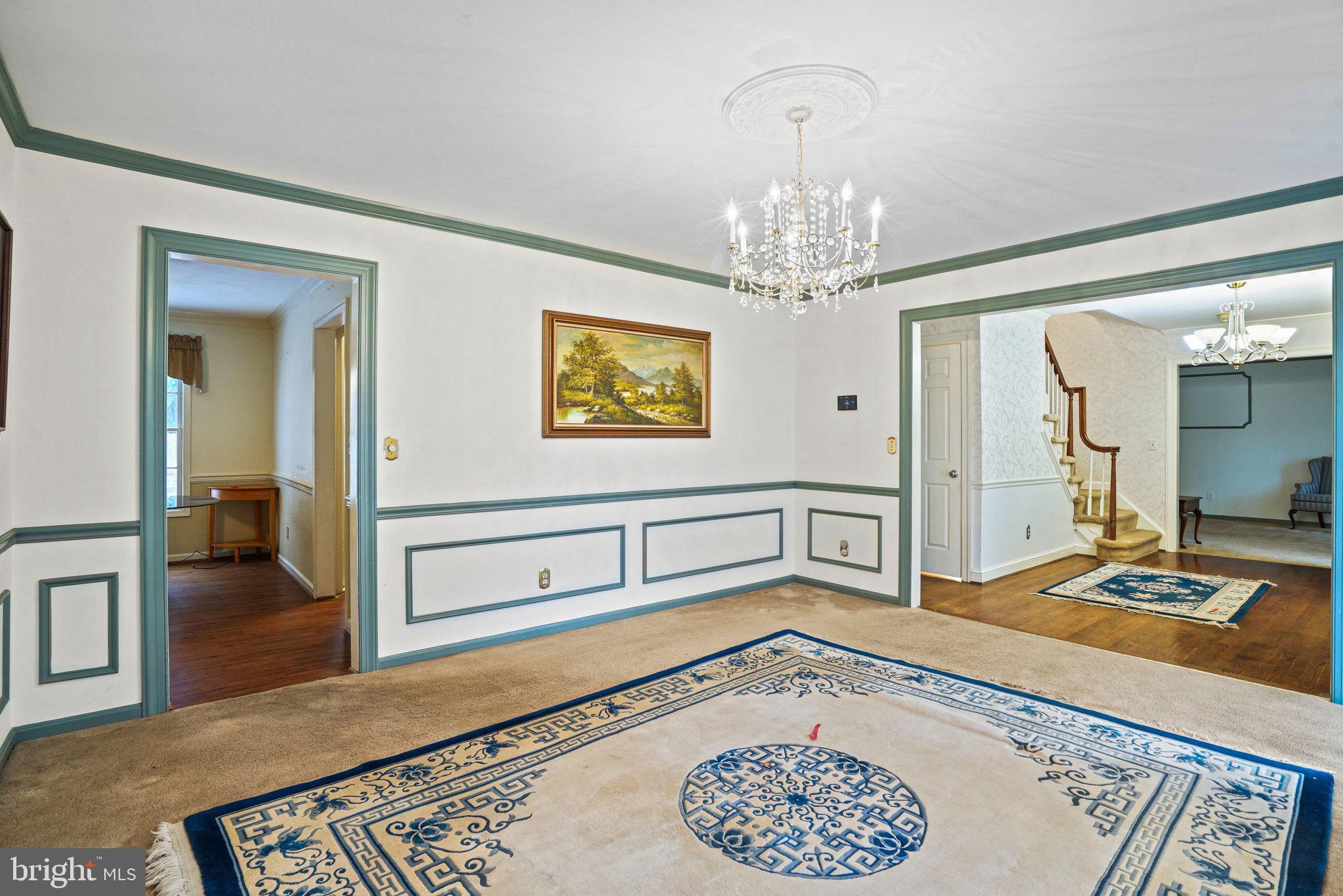12737 Triple Crown Road Gaithersburg, MD 20878 - Photo 13 of 61 a spacious bedroom with a bed and a chandelier