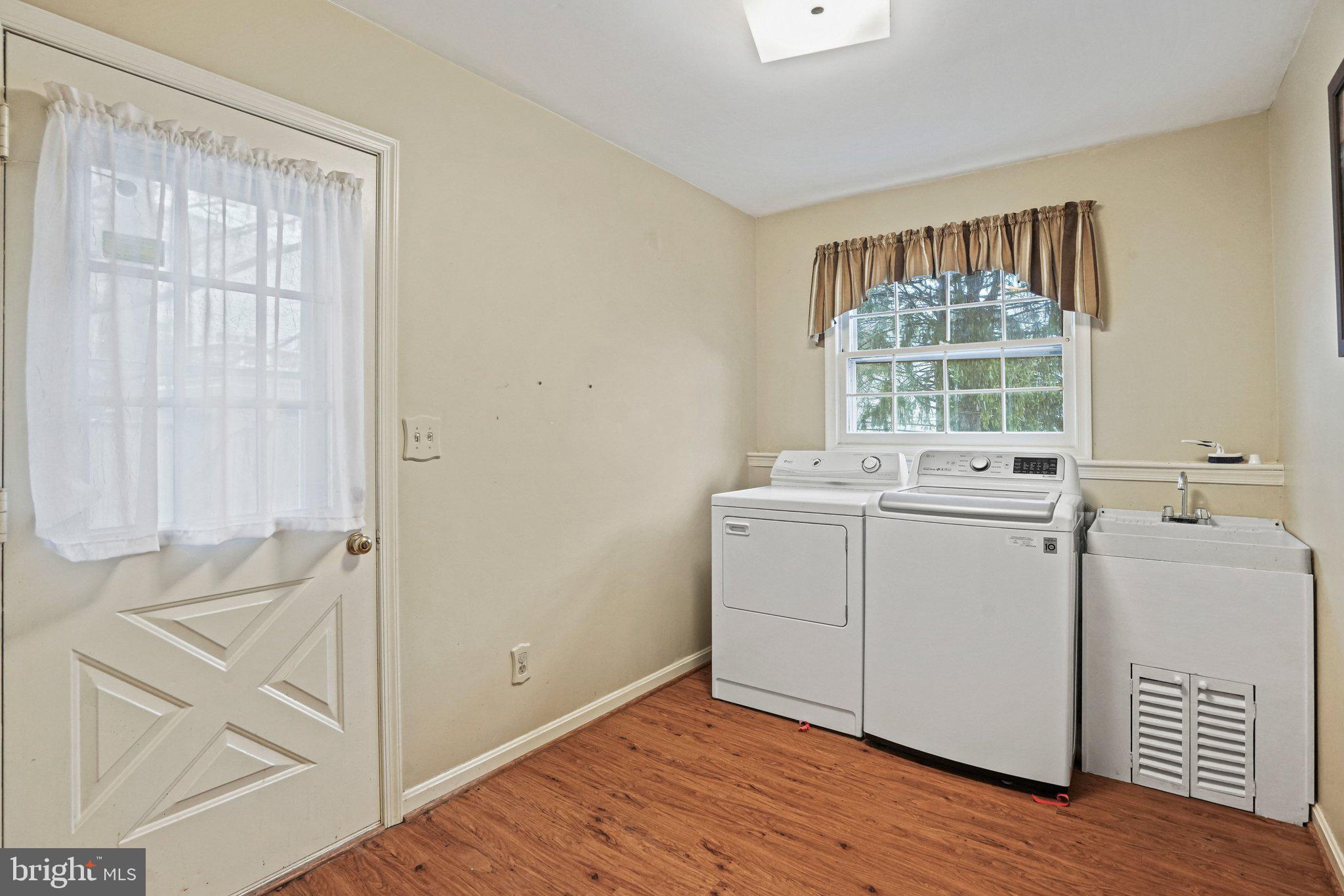 12737 Triple Crown Road Gaithersburg, MD 20878 - Photo 21 of 61 a view of utility room with wooden floor and windows