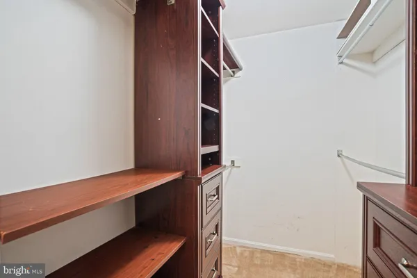 a view of a kitchen with wooden floor and stairs