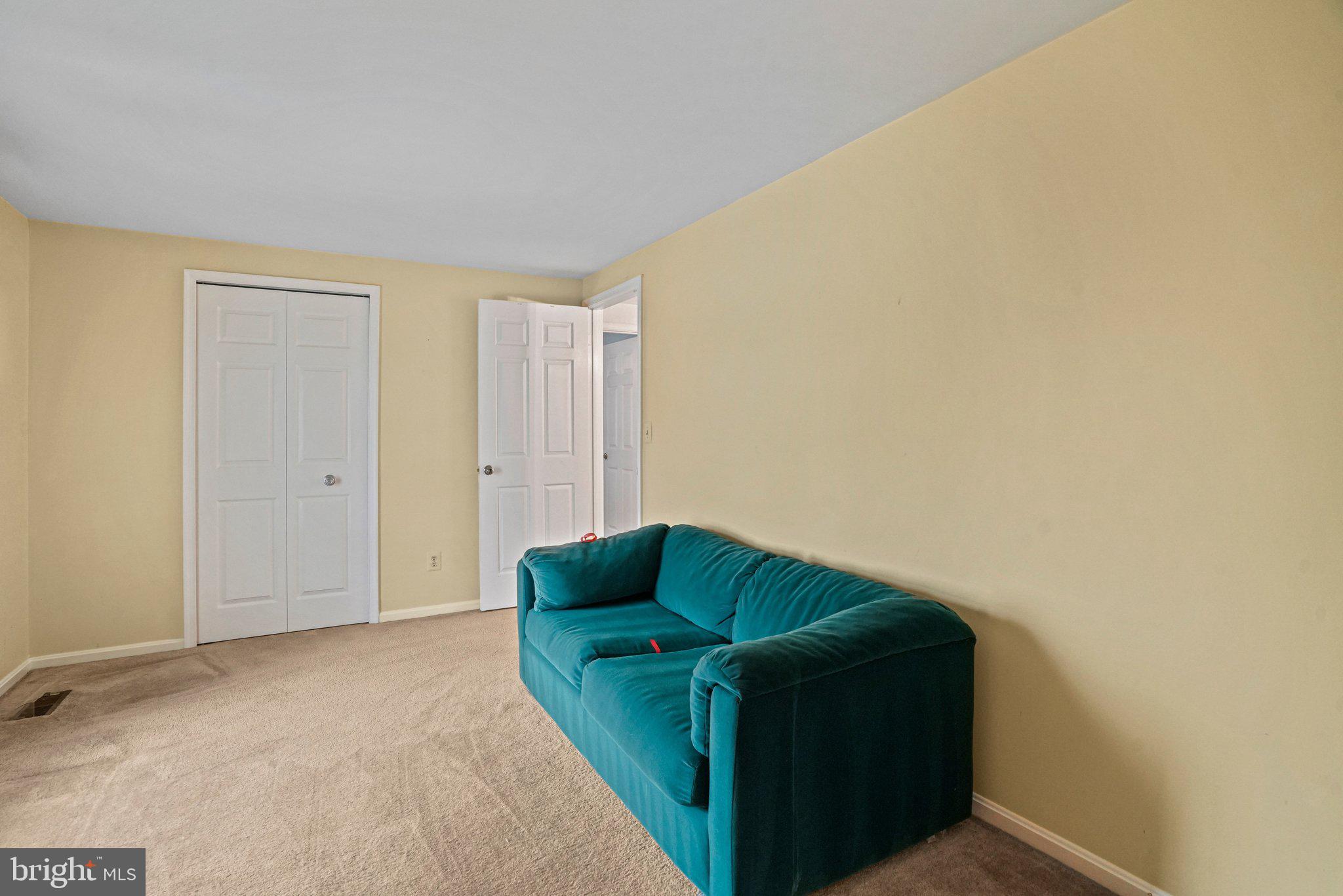 12737 Triple Crown Road Gaithersburg, MD 20878 - Photo 39 of 61 a living room with furniture and a air conditioner vent