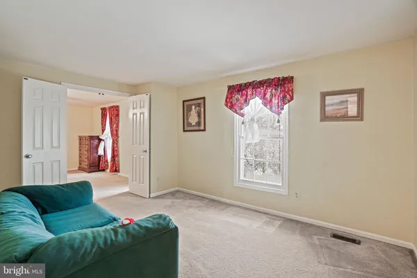 a view of a room with wooden walls