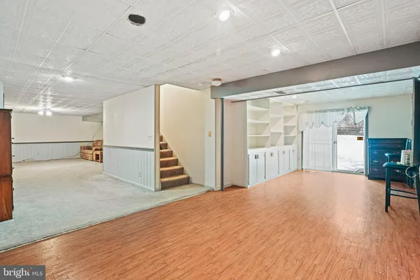 a view of a deck with wooden floor and outdoor seating