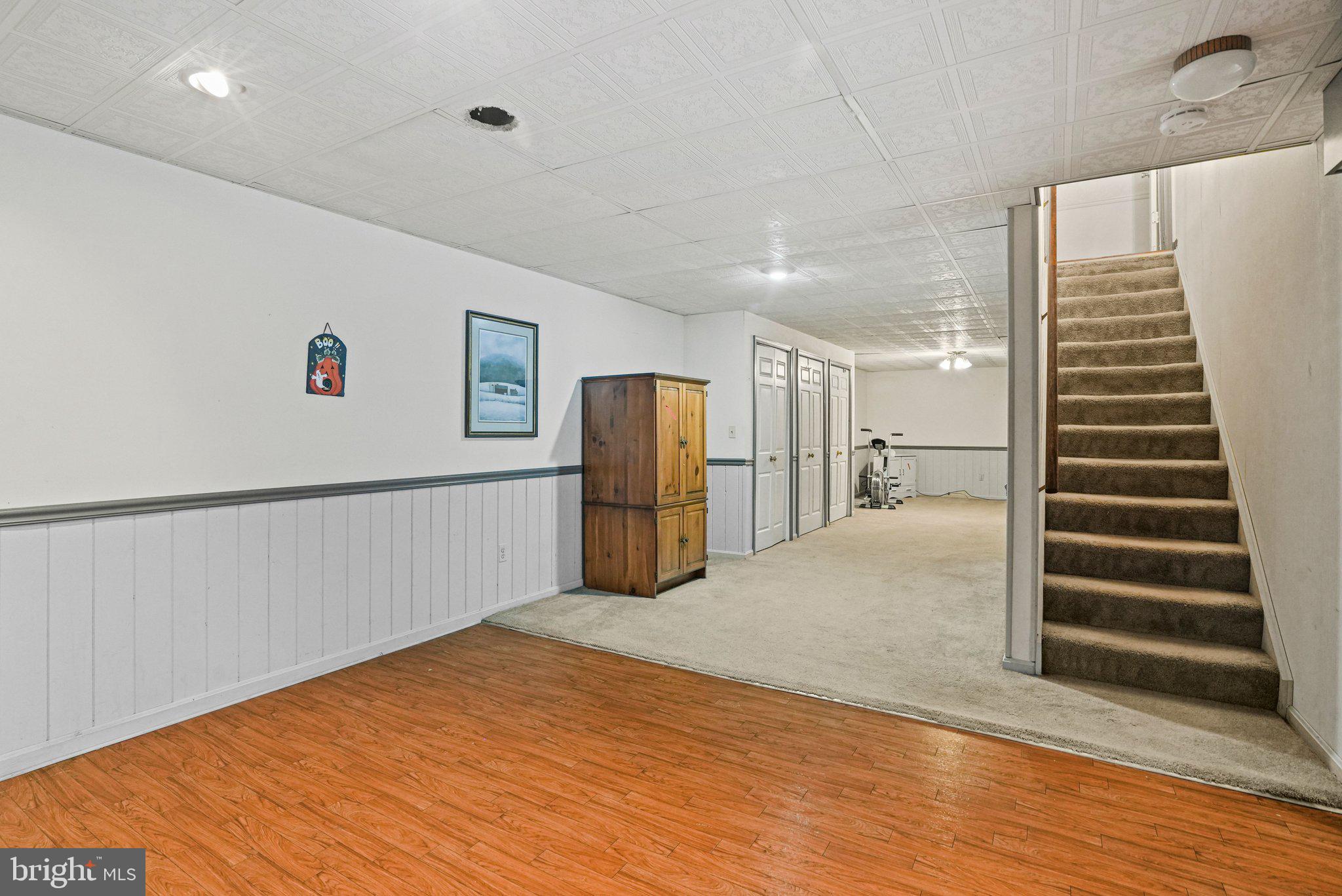 12737 Triple Crown Road Gaithersburg, MD 20878 - Photo 42 of 61 a view of a kitchen with wooden floor and stairs