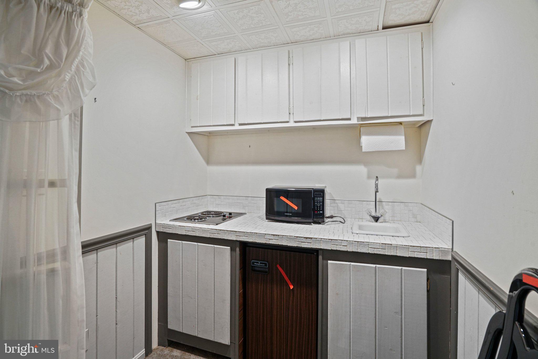 12737 Triple Crown Road Gaithersburg, MD 20878 - Photo 45 of 61 a utility room with cabinets