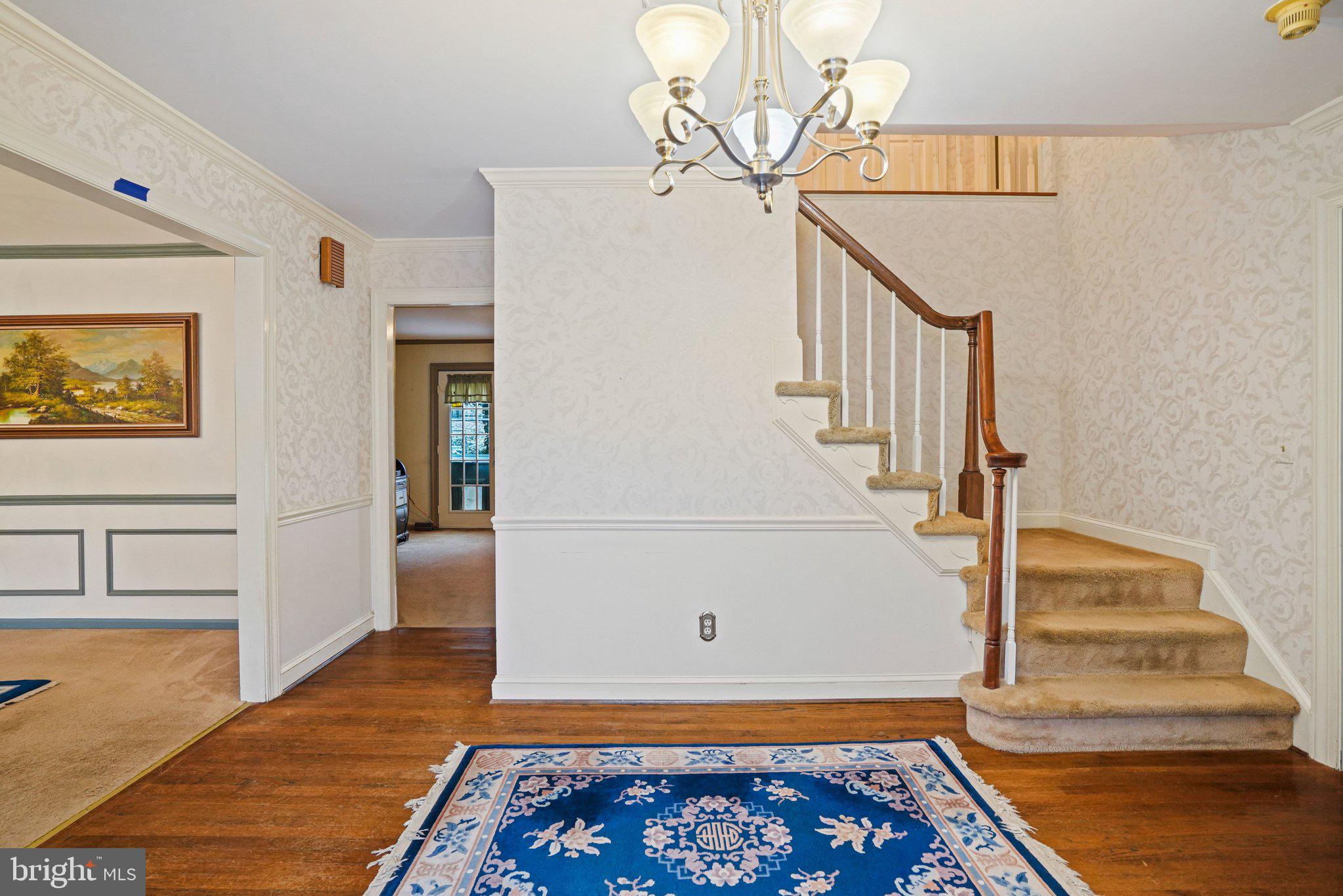 12737 Triple Crown Road Gaithersburg, MD 20878 - Photo 6 of 61 a view of entryway and hall with wooden floor