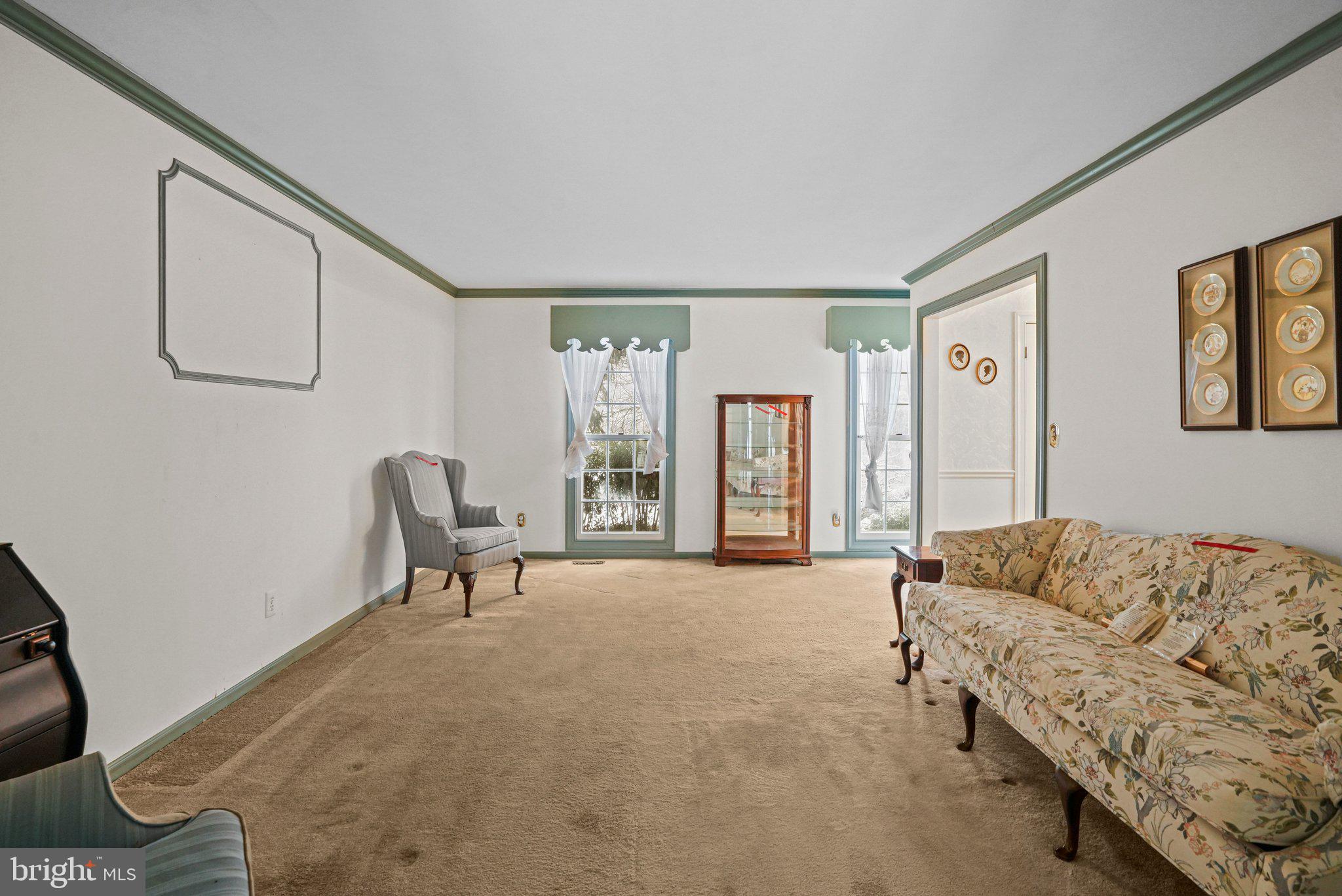 12737 Triple Crown Road Gaithersburg, MD 20878 - Photo 9 of 61 a spacious bedroom with a bed a couch and large window