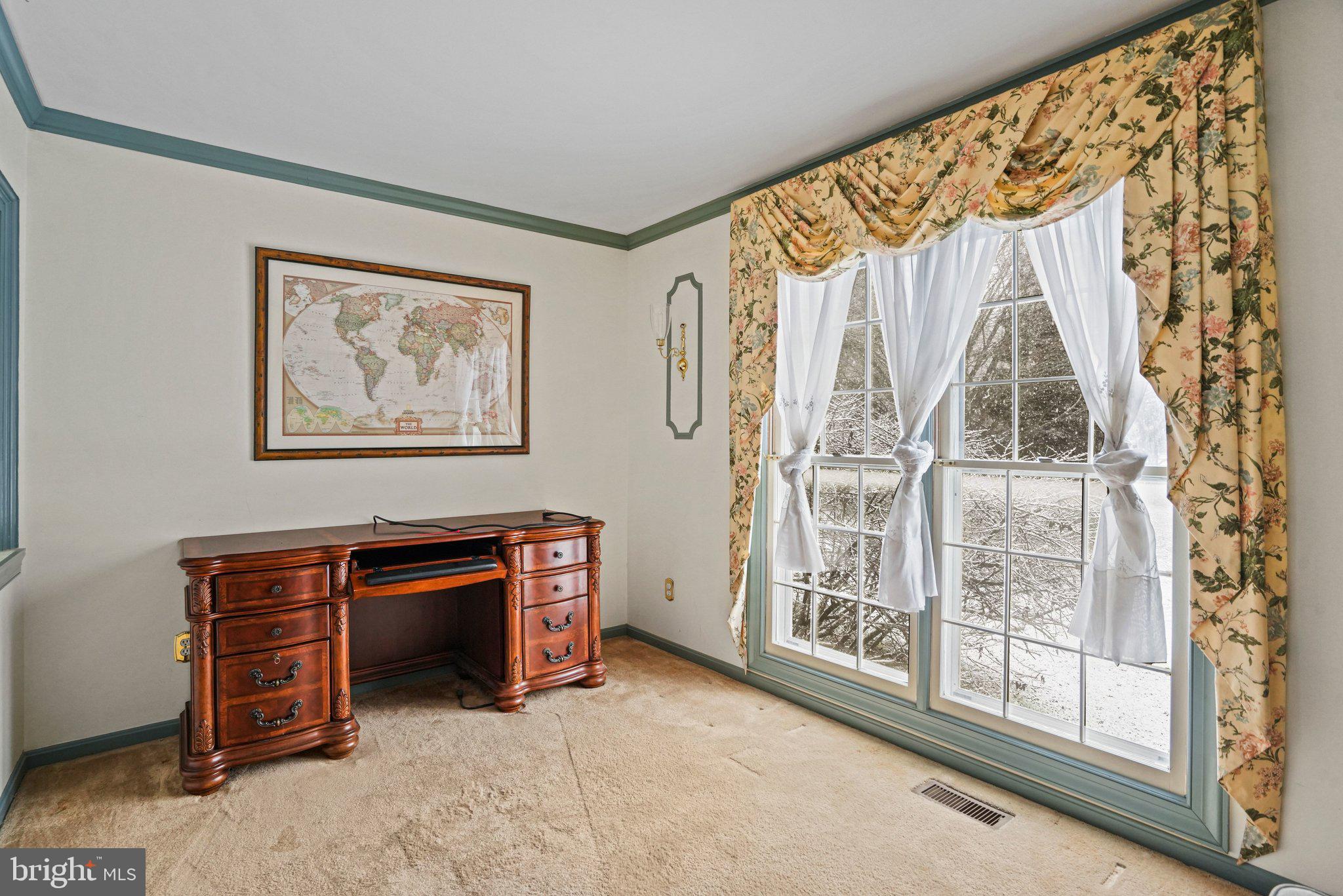 12737 Triple Crown Road Gaithersburg, MD 20878 - Photo 10 of 61 a view of an empty room with furniture and a window