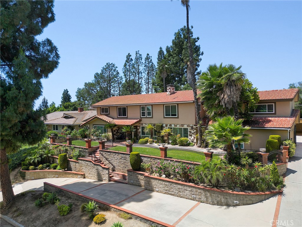 2441 Terraza Place Fullerton, CA 92835 - Photo 1 of 61 a front view of a house with a yard