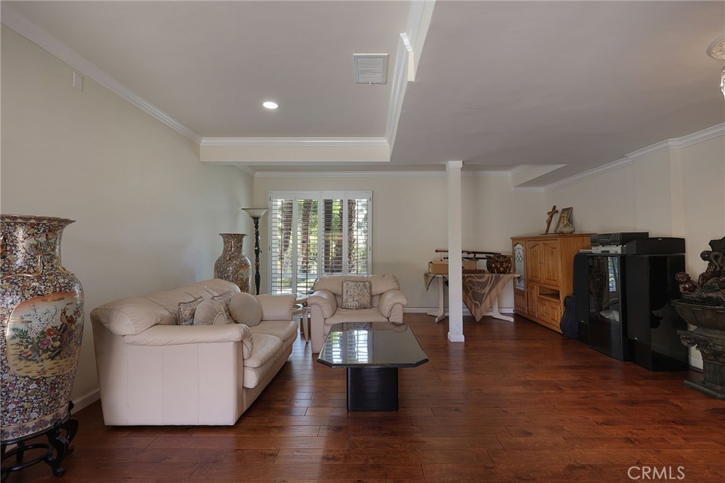 2441 Terraza Place Fullerton, CA 92835 - Photo 14 of 61 a living room with furniture and wooden floor