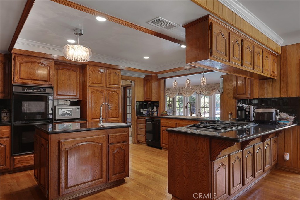 2441 Terraza Place Fullerton, CA 92835 - Photo 16 of 61 a kitchen with stainless steel appliances granite countertop a stove a sink dishwasher and a refrigerator