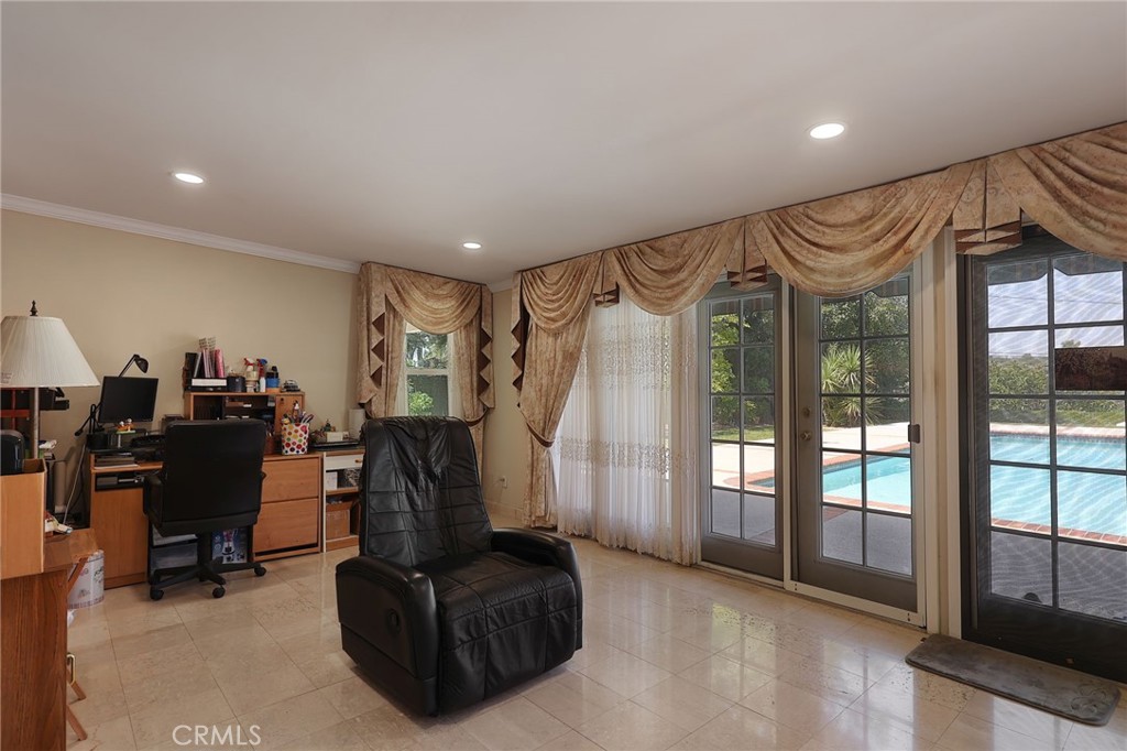 2441 Terraza Place Fullerton, CA 92835 - Photo 25 of 61 a living room with furniture and a chandelier