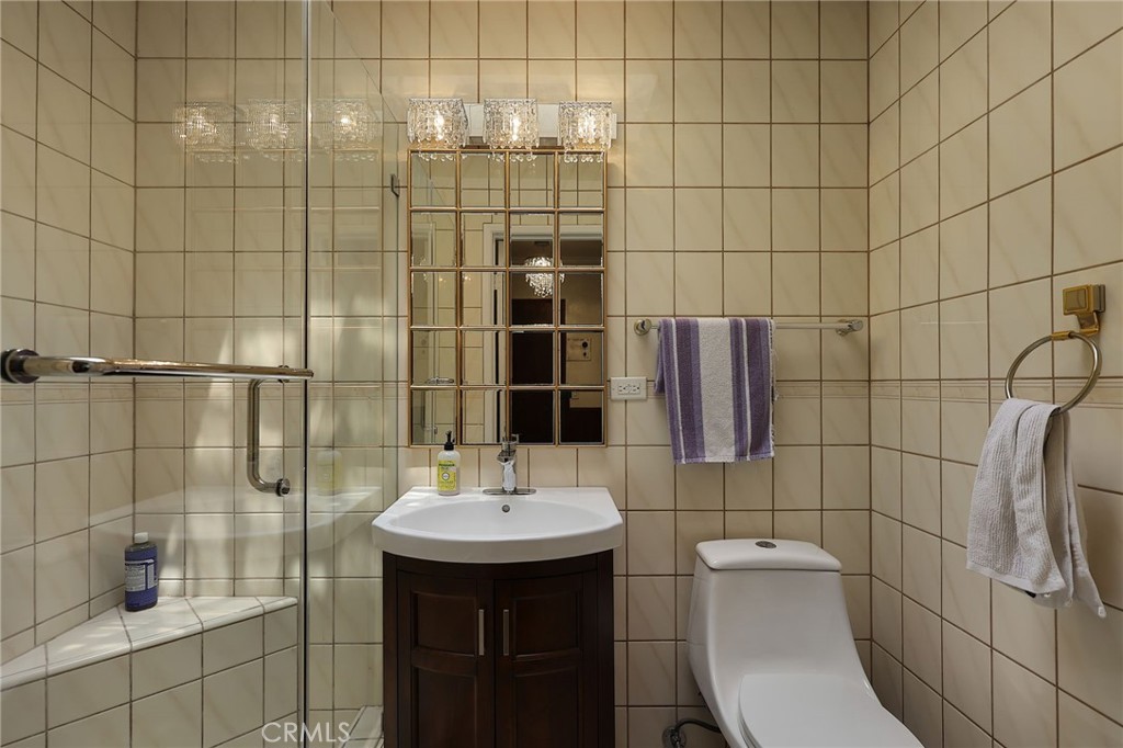 2441 Terraza Place Fullerton, CA 92835 - Photo 26 of 61 a bathroom with a sink toilet and shower
